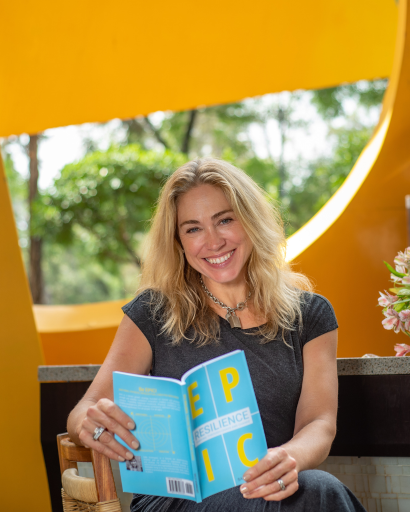 Sally Dominguez holding the EPIC Resilience book